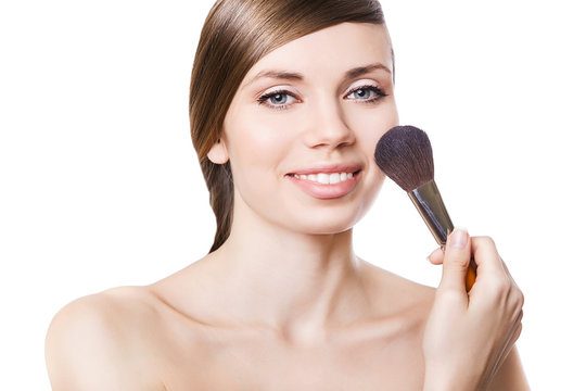 natural smiling woman and brush on cheek