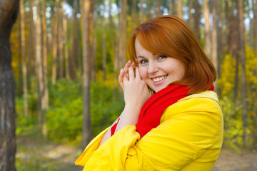 Naklejka premium Portrait of red-haired girl outdoors