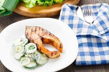 Grilled salmon with cucumber salad