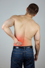 Young man with back pain