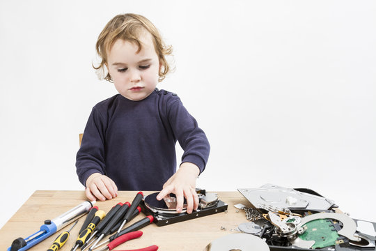 Child Repairing Computer Part