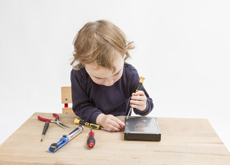 young child opening hard drive