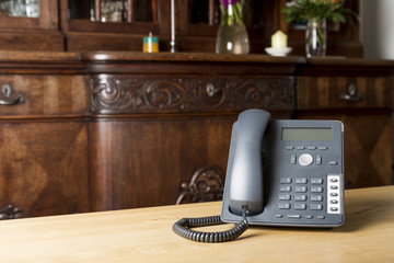 phone on wooden table in living room