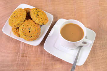 Cookie on a wooden floor.