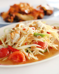 spicy papaya salad and roasting chicken