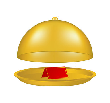 Open golden cloche with blank paper card