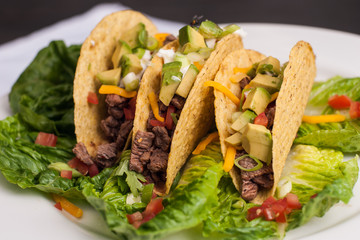 Trio of roast beef hard-shell tacos