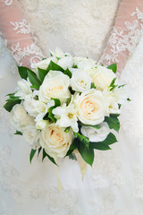 A bouquet of white roses. The bride, a wedding, a holiday. white