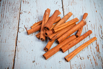 cinnamon sticks on wooden background