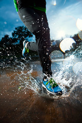 Single runner running in rain - 58161881