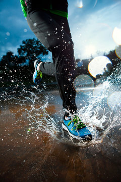 Single Runner Running In Rain