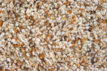 A very close view of assorted shades of brown plush carpeting