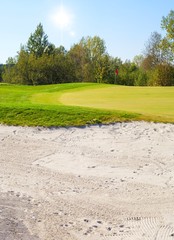 Golf course landscape view, field and sand bunker