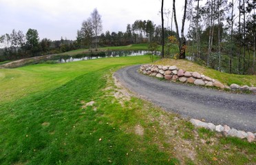 Golf course landscape view with road