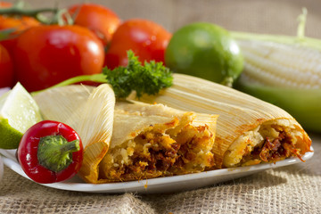 Mexican tamales on plate.