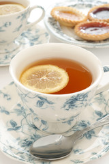 Earl Grey tea in floral bone china and a slice of lemon
