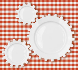 cogs and gears plates over red picnic tablecloth