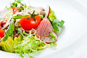 fresh salad with greens and meat
