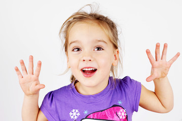 Cute little girl playing trick