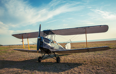 Biplane - vintage aircraft on airfield