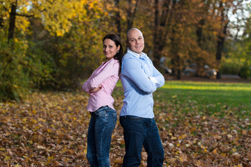 Happy Young Couple With Arms Crossed