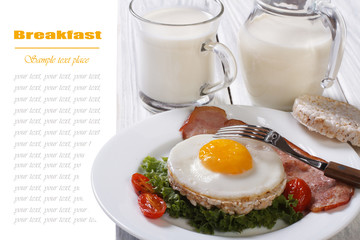 scrambled eggs with vegetables, rice crackers and milk.