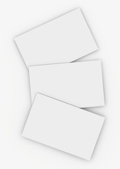 White sheets lying one behind the other