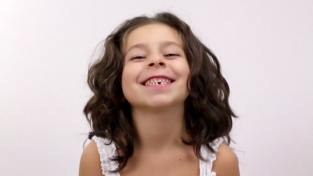 A cute young girl do happy facial expression