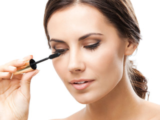 Fototapeta premium Young woman with cosmetics brush, isolated