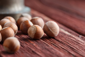 Hazelnuts, filbert on old wooden background