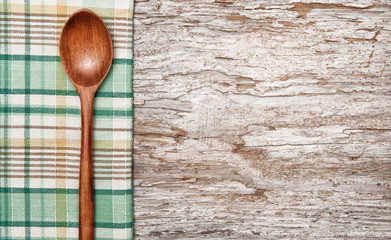 Kitchen utensils on the old wood background