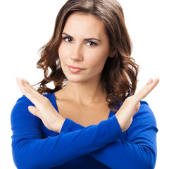 Serious woman with stop gesture, isolated