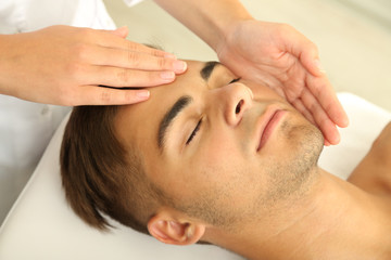 Fototapeta na wymiar Man having head massage close up