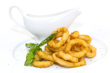 fried calamari rings on a white background