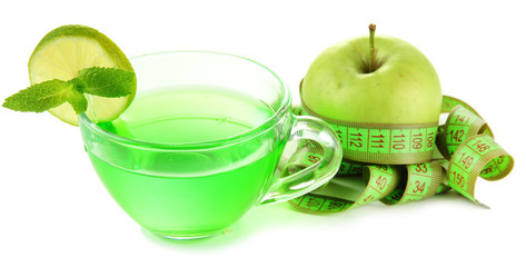 Transparent cup of green tea and apple isolated on white