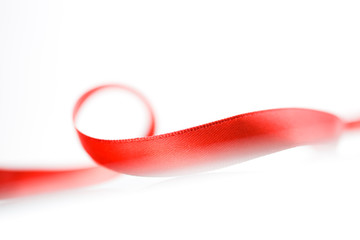 Beautiful fabric red ribbon on white background