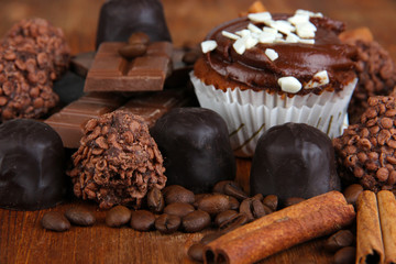Tasty cupcake with different sweets close up