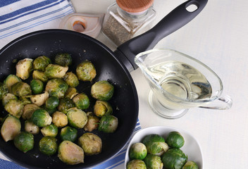 Fresh brussels sprouts in pan with vegetables and spices