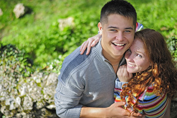 Young beautiful couple in park