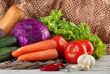 Composition of different vegetables on table on brown