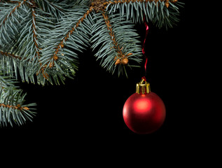 Red christmas ball on black background