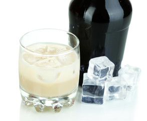 Baileys liqueur in bottle and glass isolated on white
