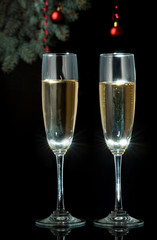 Flutes of champagne in holiday setting. Closeup.