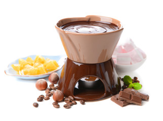 Chocolate fondue with marshmallow candies and fruits, isolated