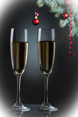 Flutes of champagne in holiday setting. Closeup.