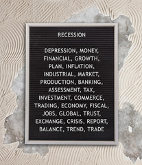Recession concept in plastic letters on very old menu board
