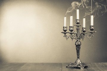 Vintage candelabrum with five reek candles sepia photo - obrazy, fototapety, plakaty