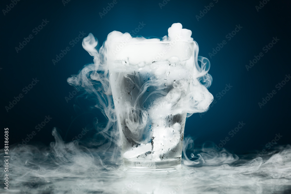 Wall mural glass of water with ice vapor