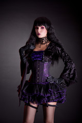 Romantic gothic girl in purple and black outfit