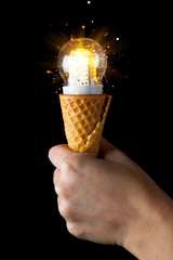 hand holding led lamp in ice cream cone